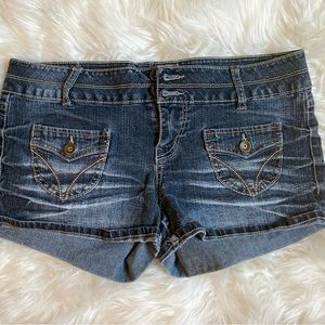Dark wash jean shorts with stitching detail on the pockets. Super cute shorts!